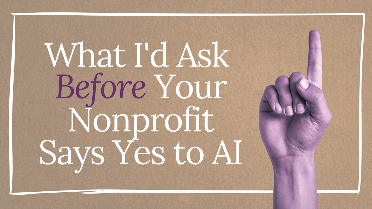 A finger pointing up, signaling 'excuse me!', and the title of the essay called 'What I'd Ask Before Your Nonprofit Says Yes to AI'